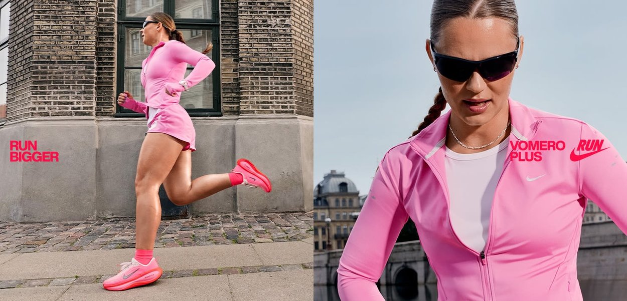 Completo sportivo rosa, composto da una giacca con zip a maniche lunghe e pantaloni corti. Presenta le scarpe Nike Vomero Plus in un vivace rosa. Tessuto liscio, design aderente.