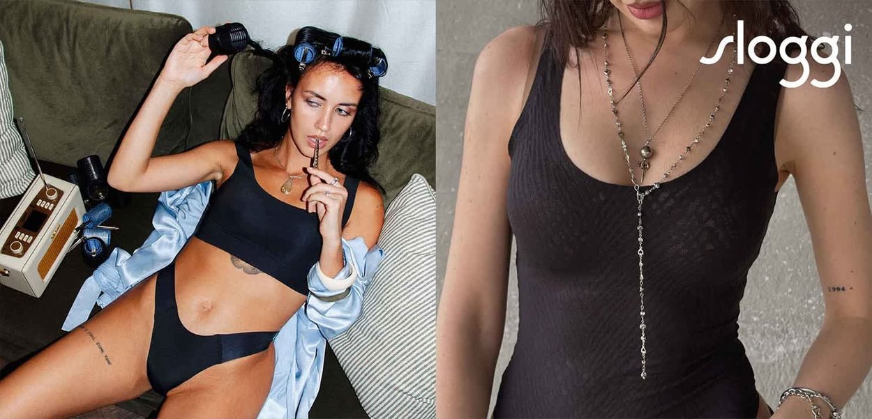Set di lingerie nera composto da un tessuto liscio e elastico con slip a vita alta. Include un top aderente con una sottile trama.