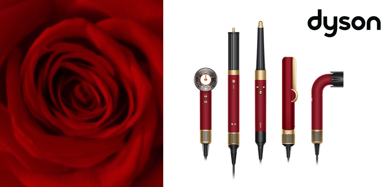 Dyson sæt med røde og gyldne hårstylingværktøjer vist foran en nærbillede af en rød rose, med hvid Dyson-logo øverst til højre.