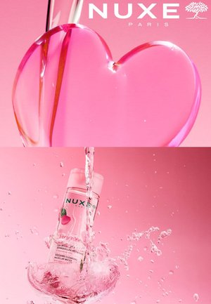 Pubblicità a tema rosa che mostra l'acqua micellare NUXE che spruzza con un disegno liquido a forma di cuore e il logo del marchio sopra.