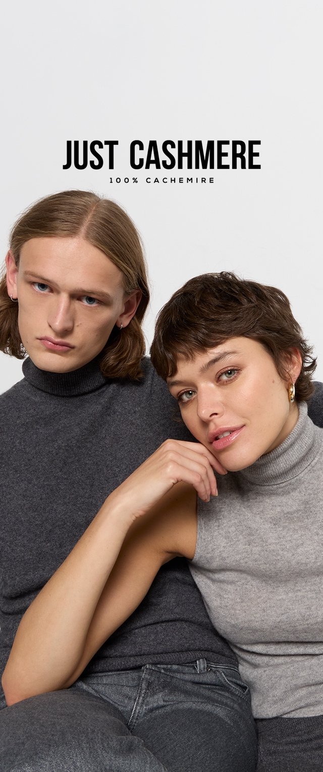 Deux mannequins portant des pulls en cachemire ; l'un en gris foncé, l'autre en gris clair. Le texte au-dessus indique "JUST CASHMERE 100% CACHEMIRE."