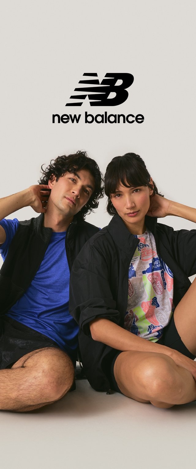 Two people in athletic wear sit on the floor, hands behind heads, with New Balance logo and text above them on a plain background.