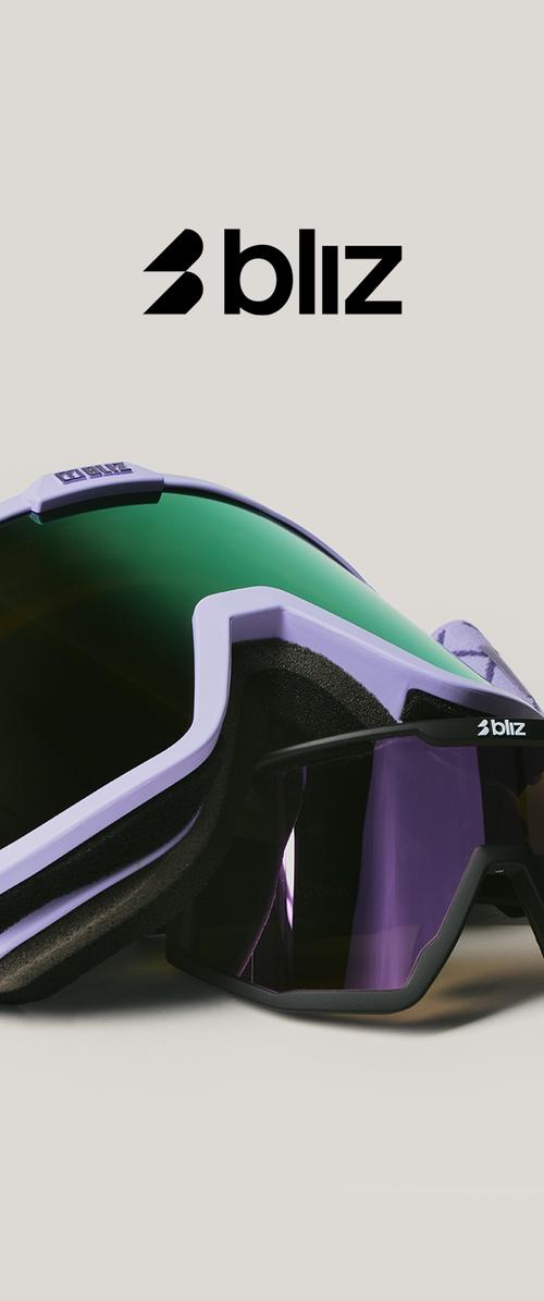 Gafas de deporte Bliz con lentes de escudo verdes y morados, un marco morado estructurado y acolchado de espuma suave para mayor comodidad.