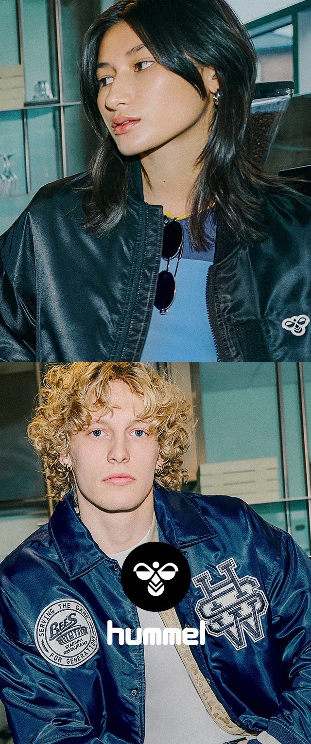 Two individuals wear jackets; one has a black, shiny bomber jacket, while the other sports a blue, embroidered satin varsity jacket.