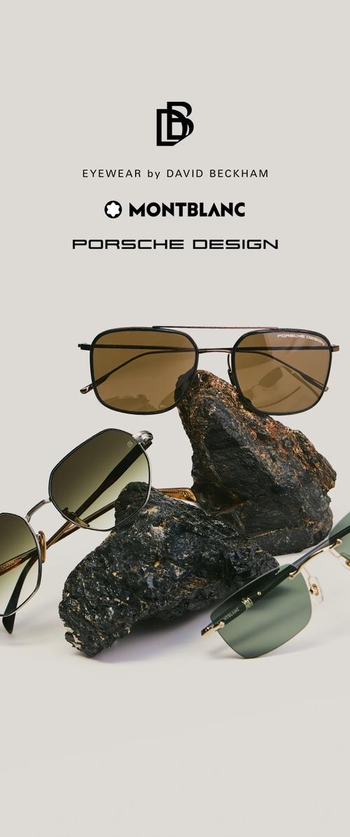 Tres pares de gafas de sol de diseño exhibidos sobre rocas oscuras y texturizadas con los logotipos de Eyewear by David Beckham, Montblanc y Porsche Design encima.