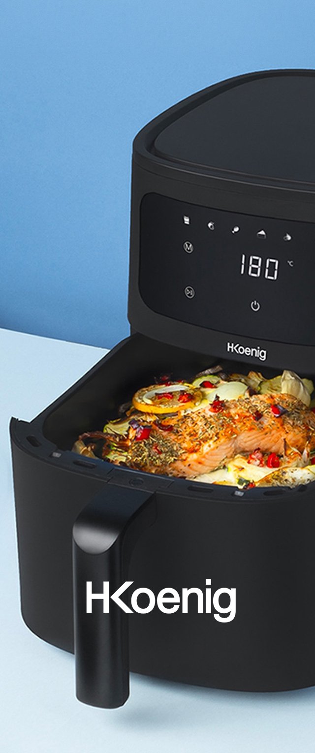 Schwarze Heissluftfritteuse mit einer runden Oberseite, digitales Display zeigt 180°C an und hat einen seitlichen Griff. Enthält gekochte Speisen mit Kräutern und Gemüse.