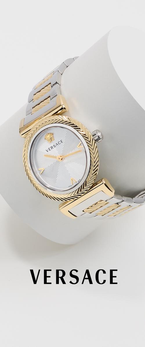 Versace-Armbanduhr mit geflochtenem Armband aus Gold- und Silbermetall, strukturiertem, rundem silbernem Zifferblatt, goldfarbenen Zeigern und goldfarbener Medusa-Logo bei 12 Uhr.
