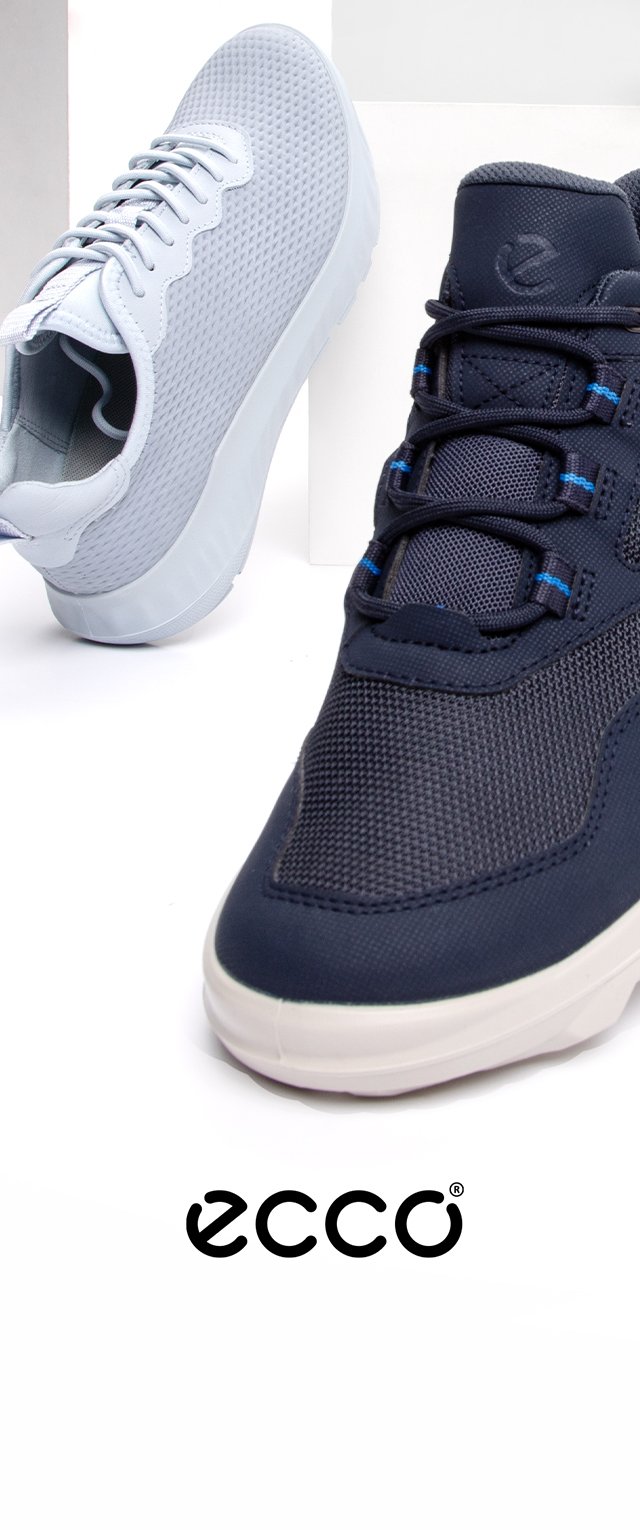 Sportliches Schuhwerk mit einem oberen Teil aus marineblauem Netzstoff und blauen Akzenten sowie einer weißen Sohle, daneben hellgraue Schuhe mit einer strukturierten Oberfläche.