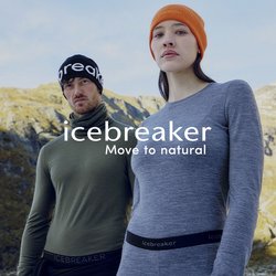 Dva dospělí v outdoorovém oblečení s potiskem značky na spodním prádle a čepicích stojící před horským terénem pod jasnou oblohou.