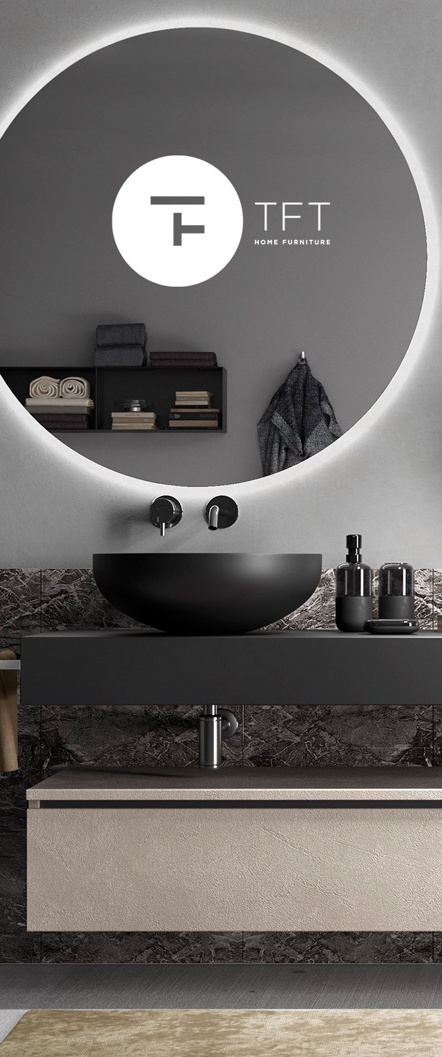 Black round sink above a textured beige vanity. Wall features a large circular mirror with backlighting. Dark marble backdrop with accessories.