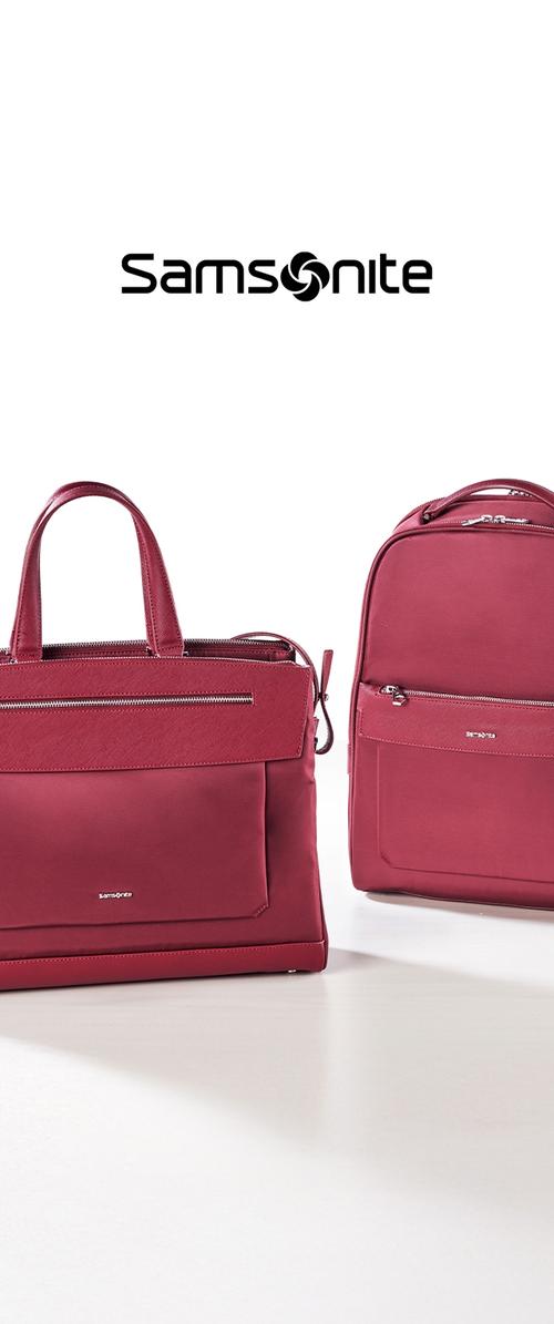 Zwei burgunderfarbene Taschen: eine rechteckige Tragetasche mit oberen Griffen und ein Rucksack, beide mit Reißverschlüssen und minimalistischem Design. Samsonite-Logo darüber.