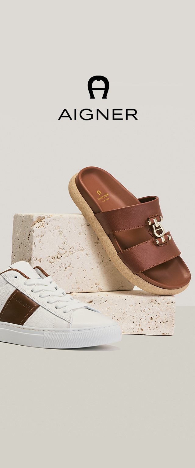 Braune Ledersandale und weißer Sneaker mit braunen Akzenten, präsentiert auf beigen Steinblöcken, Aigner-Logo oberhalb auf hellgrauem Hintergrund.