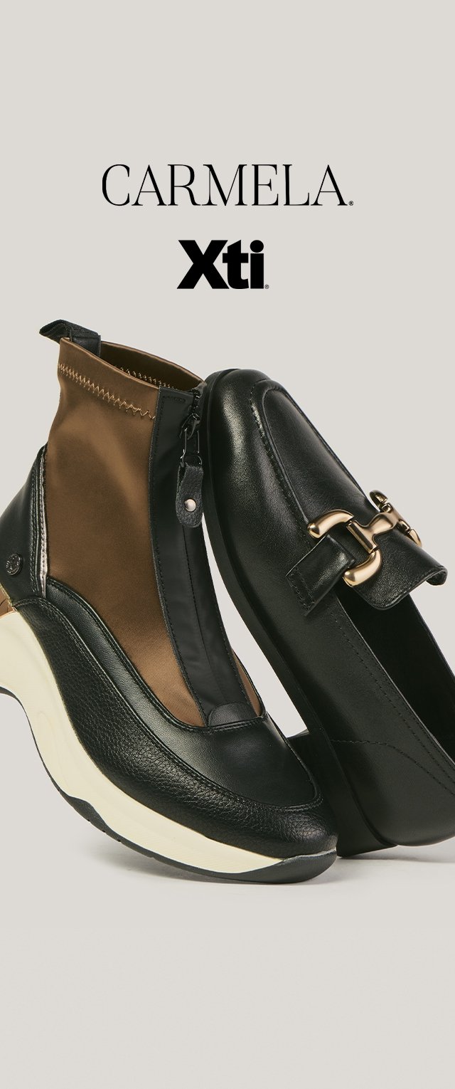 Schwarzer Lederloafer mit goldener Schnalle und schwarz-brauner Reißverschluss-Sneaker mit dicker weißer Sohle, Marken Carmela und Xti oberhalb sichtbar.