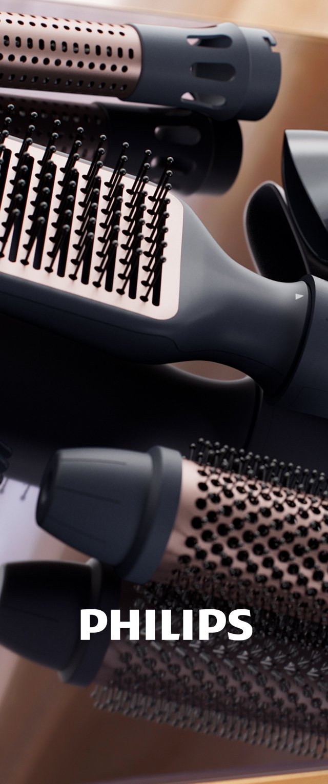 Das Styling-Tool von Philips verfügt über einen eleganten schwarzen Griff, ein rundes Fass mit pinken Akzenten und Bürstenaufsätze für vielseitiges Styling.