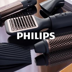 Nástroj na úpravu vlasů s černým ergonomickým tělem, několika vyměnitelnými nástavci v černé a růžově zlaté barvě, s texturovanými povrchy a otvory.