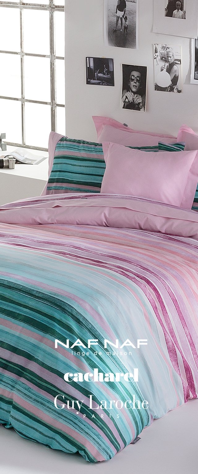 Set di biancheria da letto a righe con colori pastello tra cui rosa, verde e blu. Tessuto morbido con strisce di varia larghezza e federe coordinate.