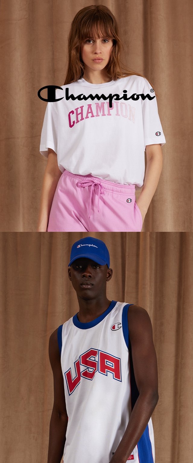 Weißes T-Shirt mit rosa "Champion"-Logo, kombiniert mit rosa Jogginghosen. Darunter ein schwarzes Sportshirt mit "USA" in roten und blauen Akzenten.