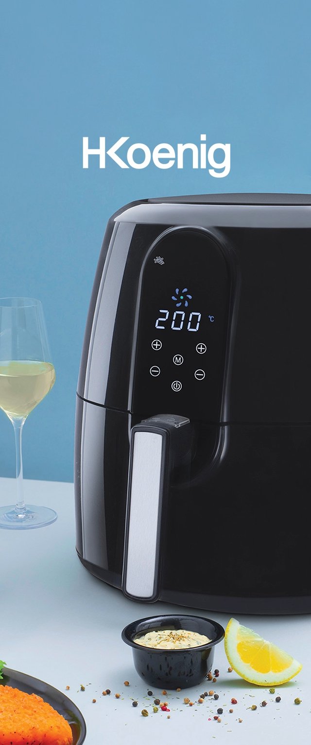 Czarna frytkownica powietrzna z wyświetlaczem cyfrowym, srebrną rączką i ustawieniem temperatury 200°C. Towarzyszą jej ryba, zioła, sos i cytryna.