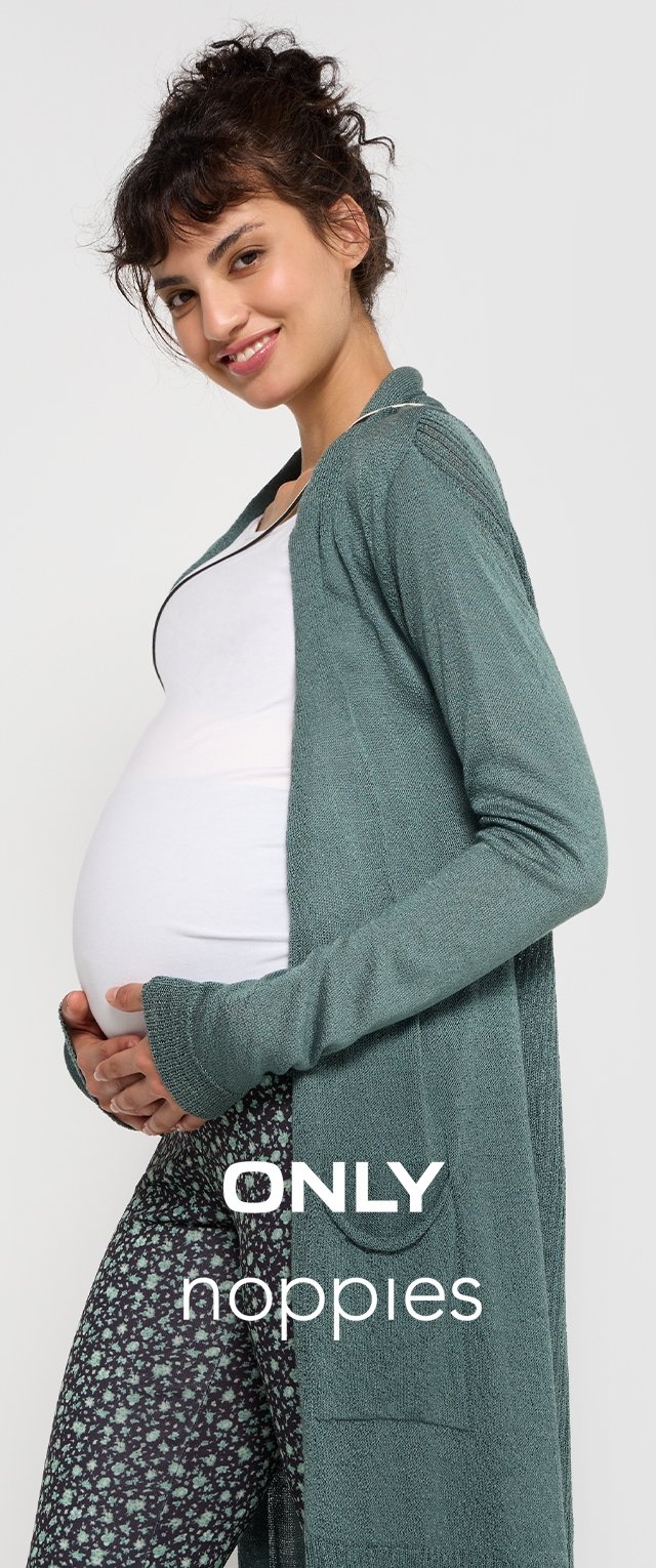 Long green cardigan with textured material, worn over a white top and patterned leggings. Model is showing a pregnancy bump.