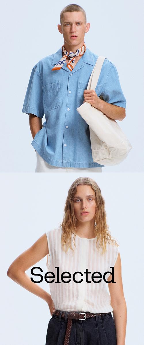 Man in blauw shirt met korte mouwen en een patroon sjaal houdt een grote beige tas vast; vrouw draagt een mouwloze witte blouse en donkere broek met riem.