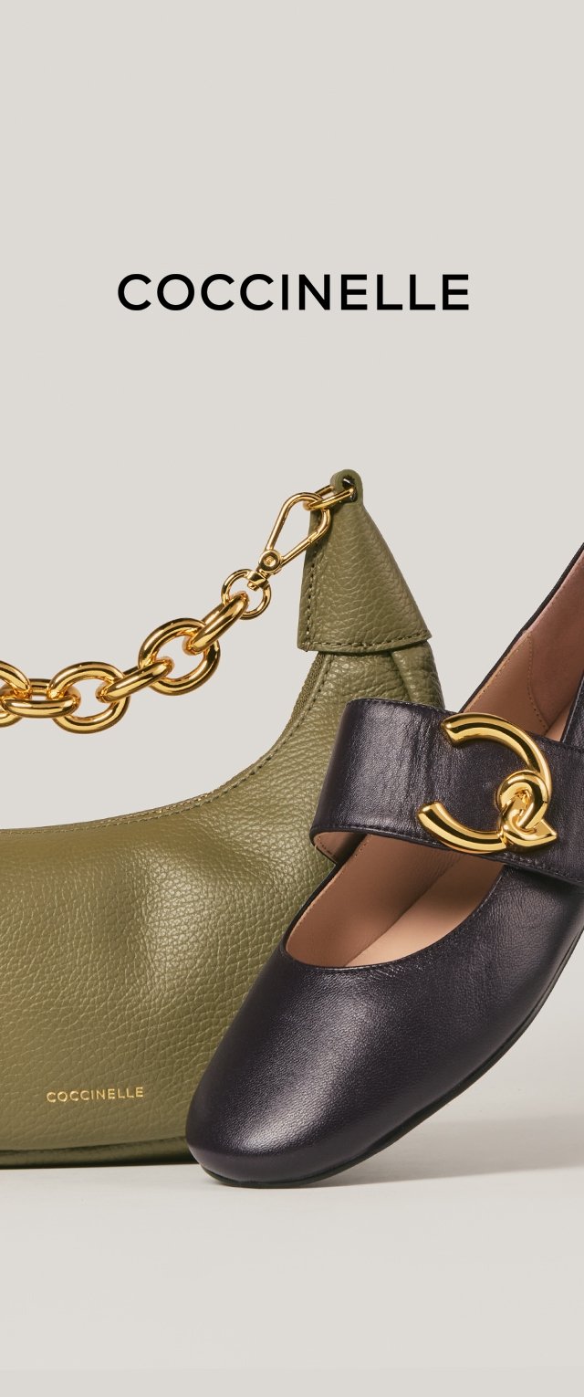 Olive roheline nahast käekott kuldse ahelrinnaga ja must nahk Mary Jane king, millel on kuldne dekoratiivne pandla.