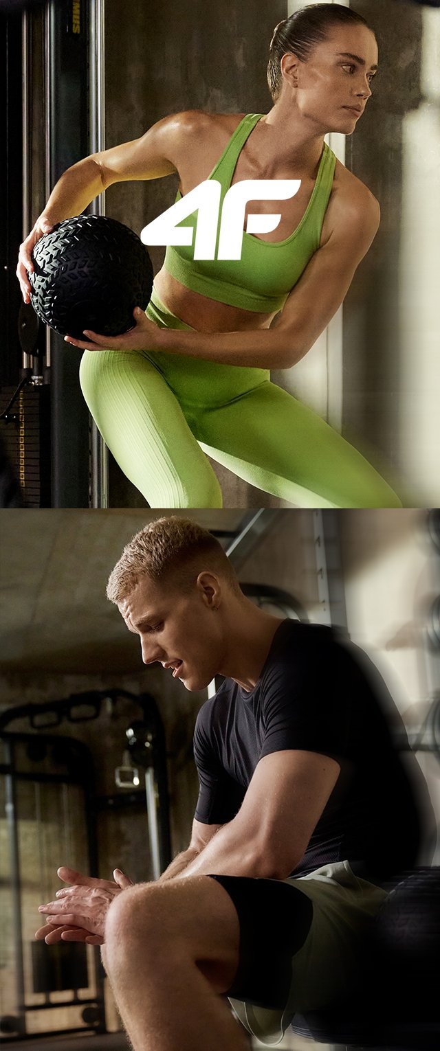 Deux passionnés de fitness dans une salle de sport intérieure. L'un porte un soutien-gorge de sport et un legging verts, l'autre un t-shirt noir et un short ; tous les deux en train de s'entraîner.