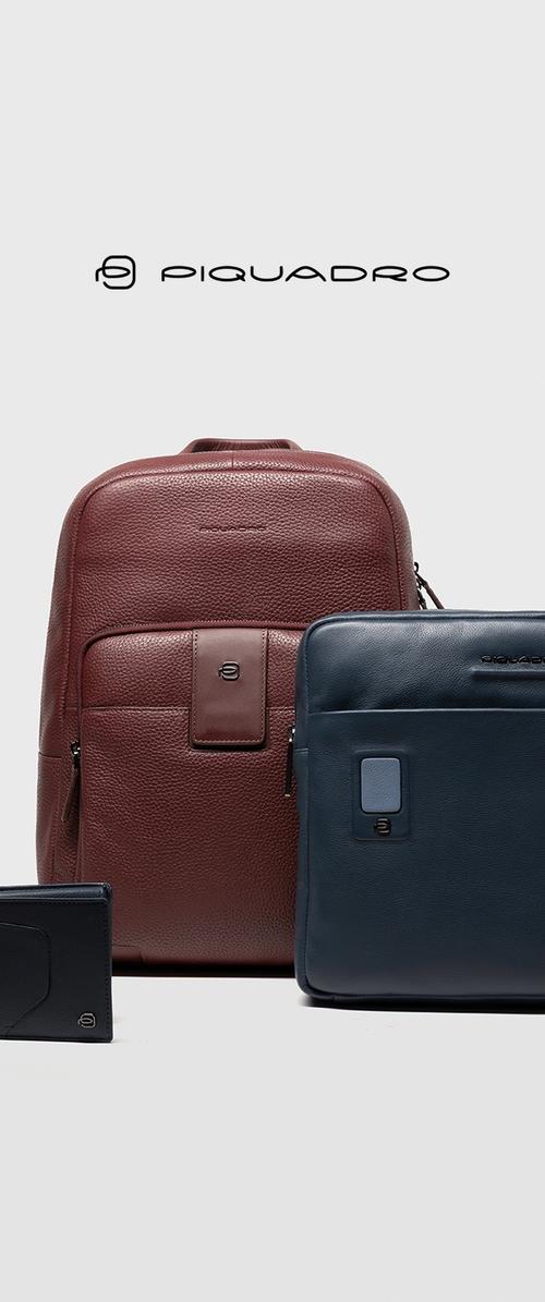 Mochila de cuero marrón con superficie texturizada, bolsa de cuero azul marino para portátil con acabado liso y billetera de cuero negra con diseño curvado.