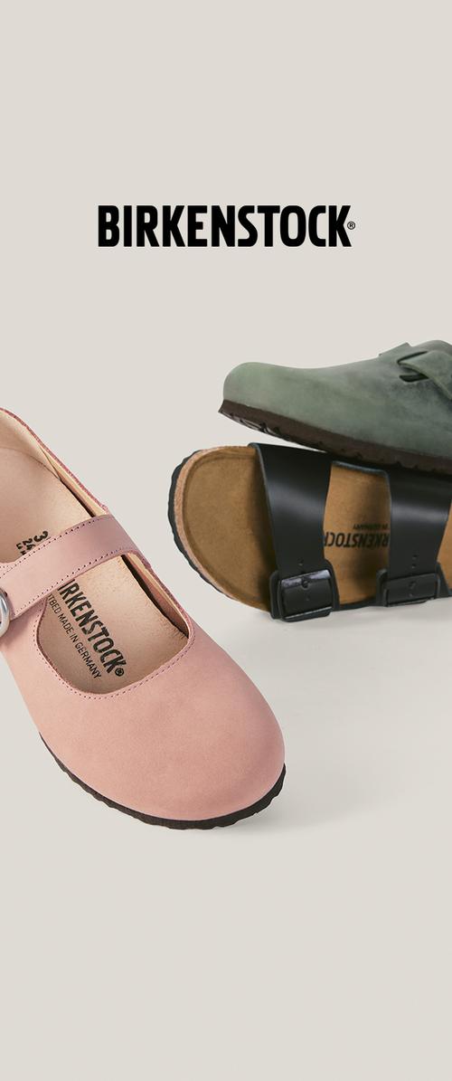 Zwei Birkenstock-Schuhe, ein pinker Mary Jane-Stil und eine grüne Sandale mit schwarzen Riemen, auf hellem Hintergrund mit Birkenstock-Logo oben.