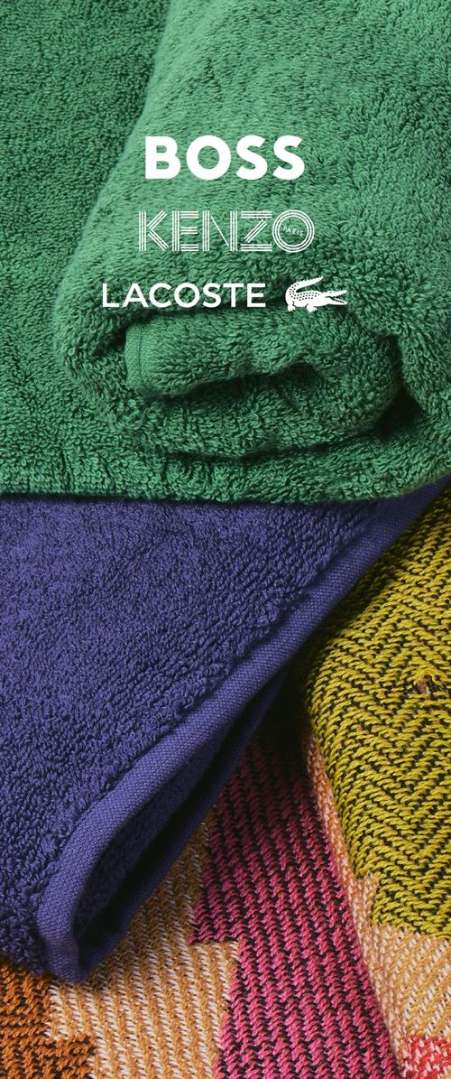 Toallas dobladas apiladas en verde, morado y tejido multicolor con los logotipos BOSS, KENZO París y LACOSTE con emblema de cocodrilo.
