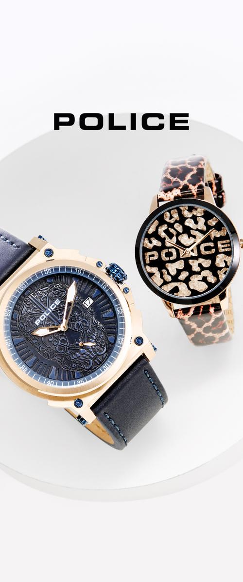 Dos relojes: uno con tono dorado, esfera azul texturada y correa de cuero negro, y otro con correa de estampado de leopardo, esfera redonda negra y acentos dorados.