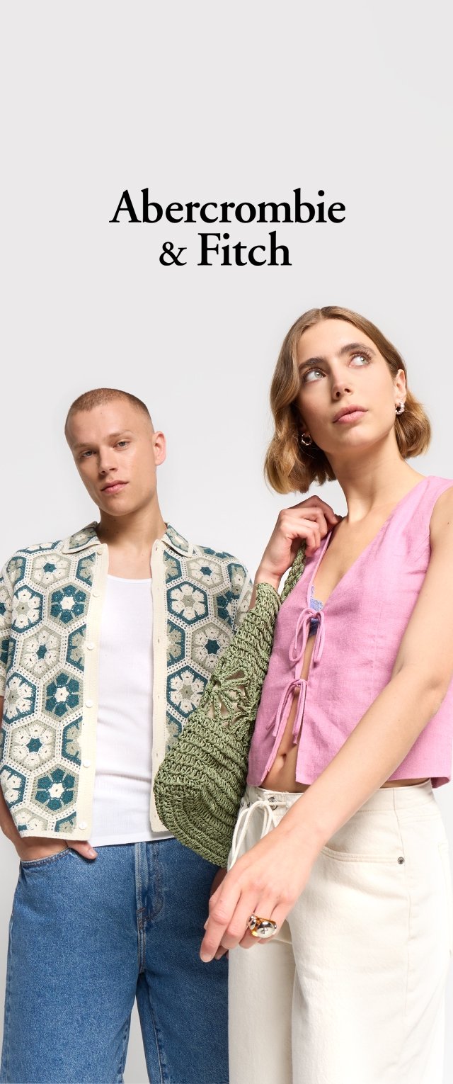 Model wearing a green crocheted bag, pink sleeveless blouse with ties, and ivory trousers. Another model in a patterned jacket over a white shirt.